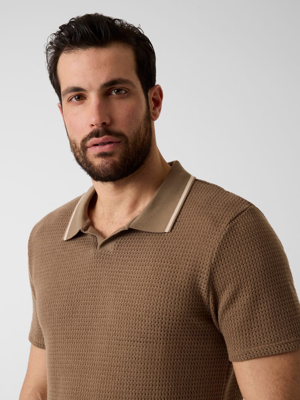 Buttonless polo shirt